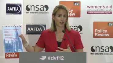 Criminal Behavioural Analyst Laura Richards holds a copy of the independent parliamentary inquiry into stalking law reforms